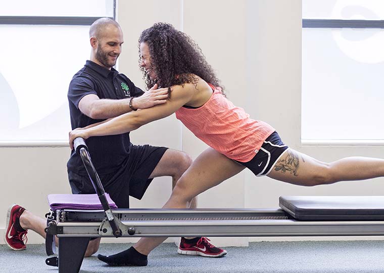 Neil Dimmock Ten Head of Fitness teaching Reformer Pilates