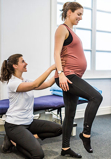 A pregnant client being assessed during a prenatal physiotherapy session to complete by a specialist physiotherapist at Ten.