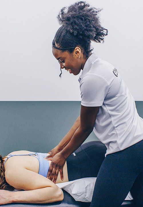 A physiotherapist treating a client at Ten Health & Fitness Physiotherapy London.